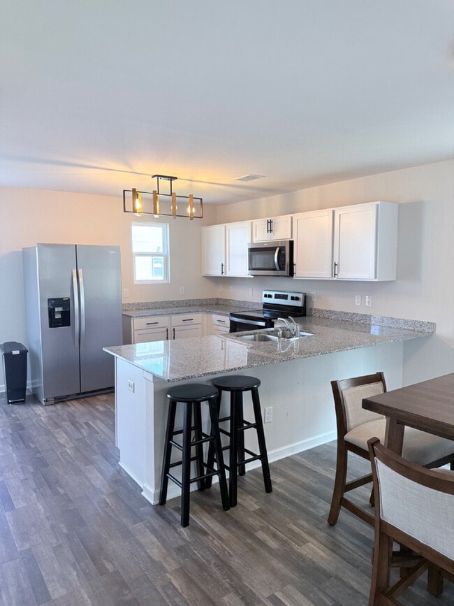 Building Photo - "Charming Coastal Retreat: 3-Bedroom on Island Breeze Lane!" **Limited-time offer: First month FR...