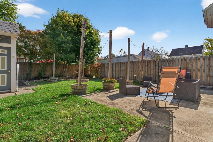 Backyard with Fenced in Yard and String Lights - 4429 S Hills Dr