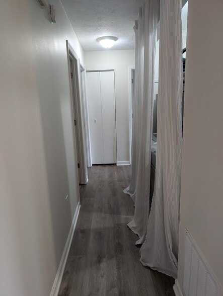 Hallway, with washer/dryer nook on the right - 1649 Summerhill Dr