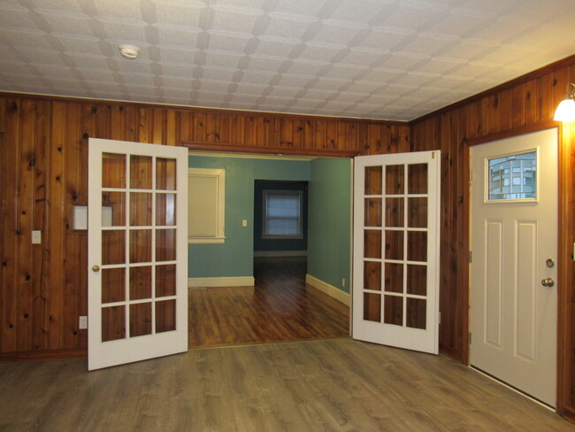 Large Family Room glass doors looking into Hall/Dining Room - 1211 Charles Ave