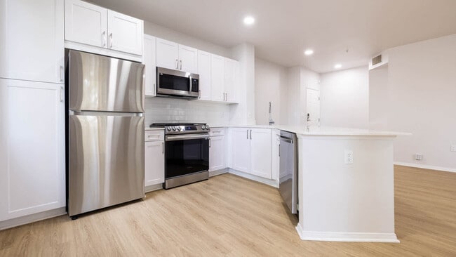 Kitchen with Stainless Steel Appliances - Bella Vista At Warner Ridge