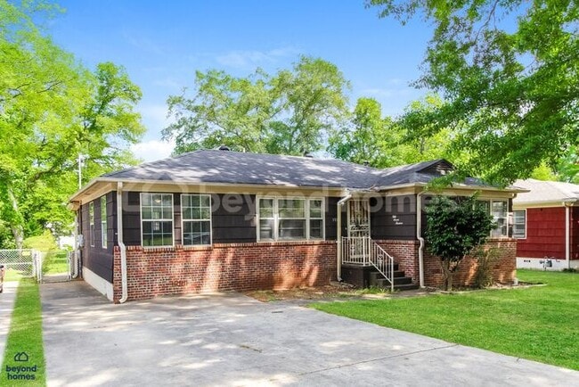 Building Photo - Updated Bungalow with Massive Deck and Fully Fenced Yard!