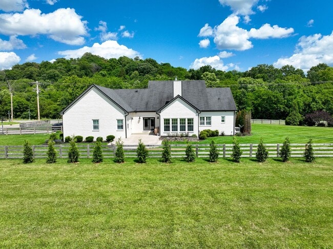 Building Photo - unning custom-built home on a full acre in...