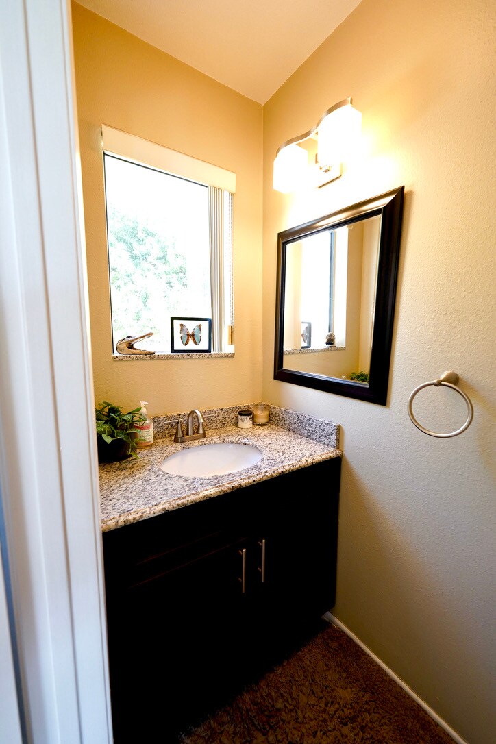 Main floor half bath with granite countertop - 3161 Weldon Ave