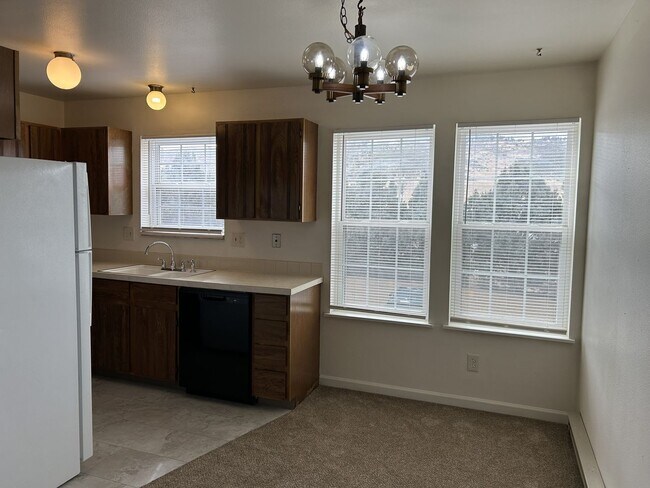Building Photo - Quiet and Sunlit Townhome with Attached Garage and Washer/Dryer Included