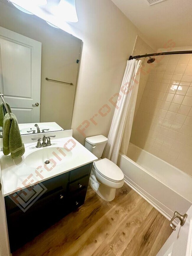 Building Photo - Beautiful 3 Story 3 Bedroom Townhouse with Huge 1st Floor Flex Space with Access to Patio + 2 Car...