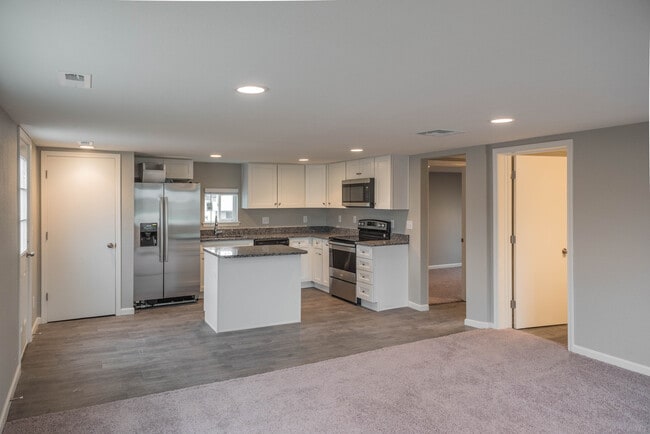 Building Photo - Remodeled home! Granite! SS Appliances!