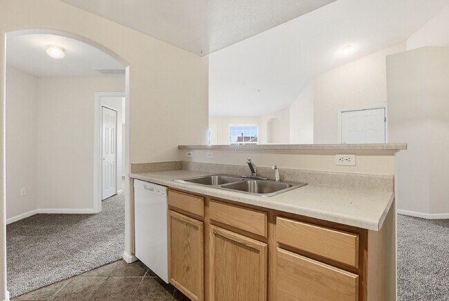 Building Photo - $1,690.95, 2-bed, 2-bath condo in a gated community with a washer/dryer.