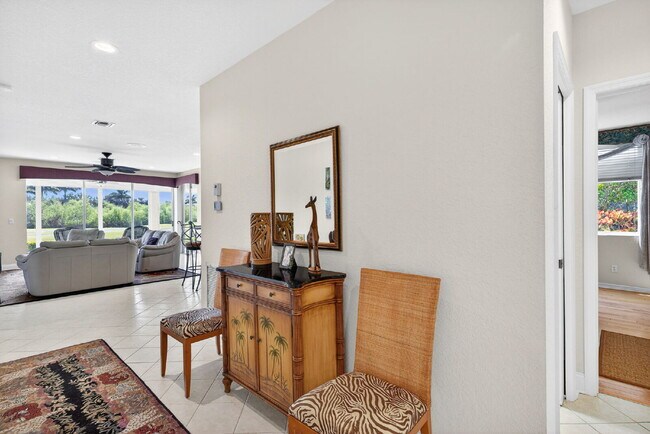 Building Photo - This 2 bedroom plus den, 2 bath condo with a one car garage offers expansive golf course and lake...