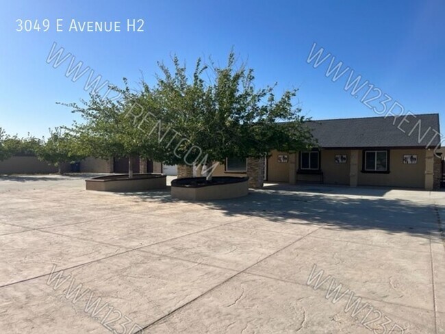 Building Photo - 3049 E Ave H10