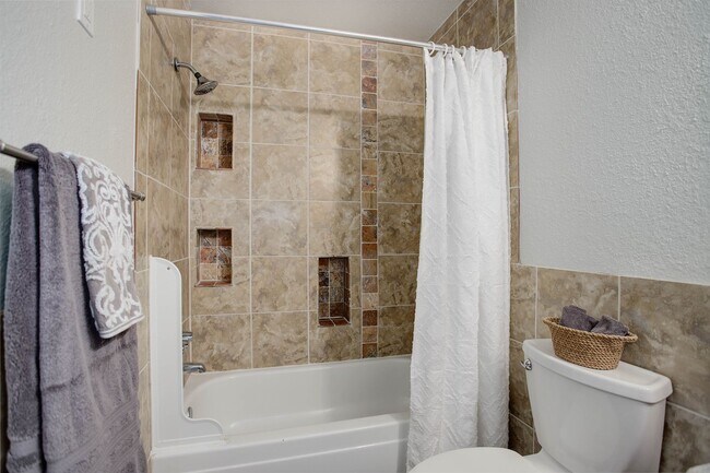 Building Photo - Penthouse level condo with views of canal and trail!