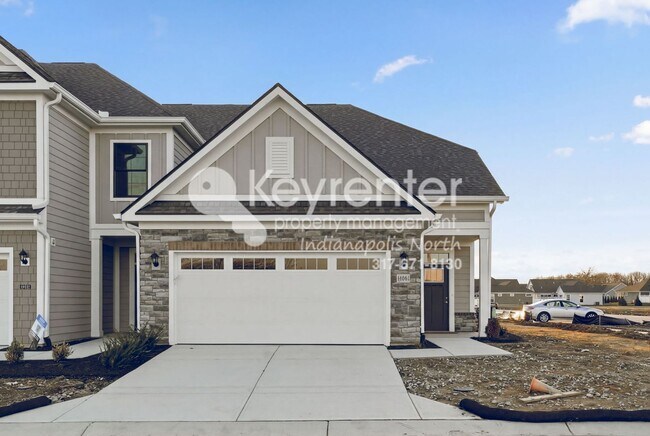 Building Photo - Located in Westfield, IN, this attractive 3-bedroom, 2.5-bath home sits on a corner lot within an...