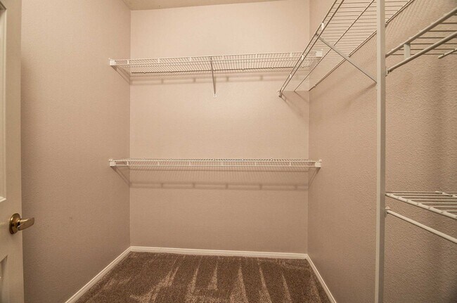 Building Photo - Cute 2 Bedroom Condo with 2 Car Garage located in a Guard Gated Community in Green Valley!