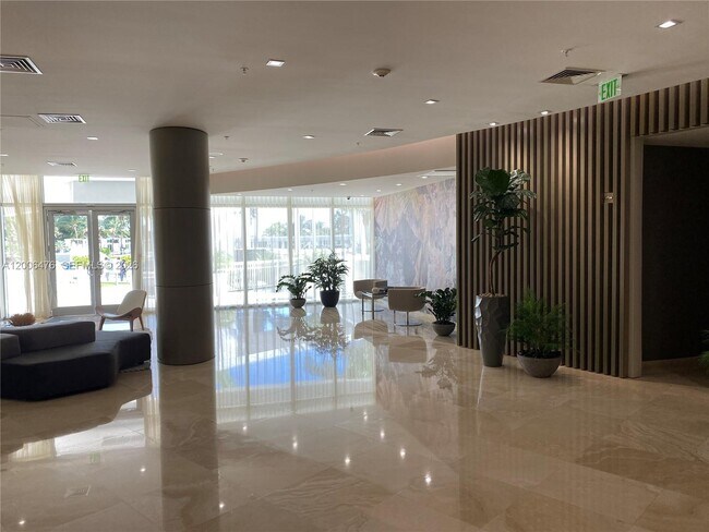 Building Photo - 10275 Collins Ave