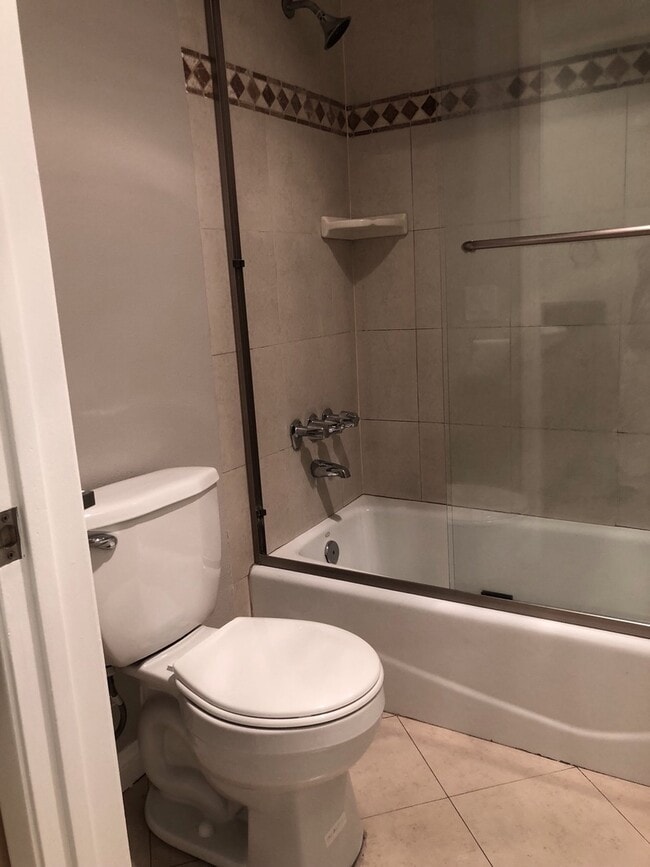 Building Photo - REMODELED CONDO WITH WOOD FLOORS! NEW KITCHEN! FIREPLACE! GYM, POOL! REC ROOM AND MORE