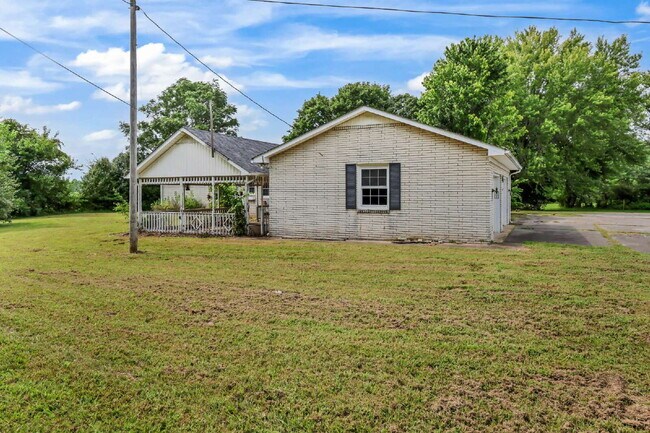 Building Photo - spacious 4-bedroom, 2.5-bath home featuring a 2-car garage and fresh updates throughout.