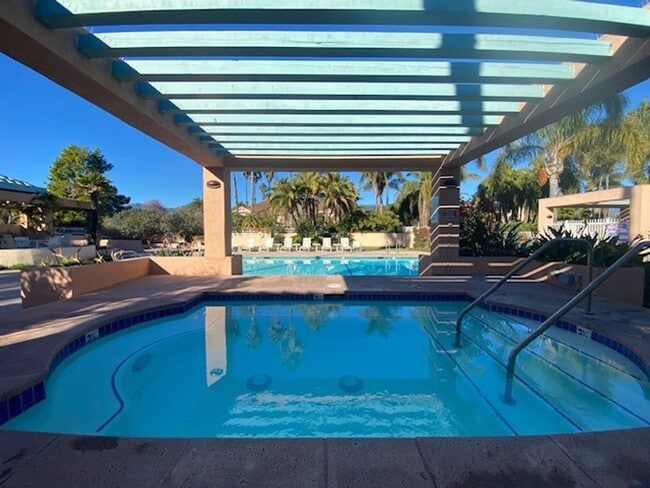 Building Photo - NEW PRICE! Spacious 3bdrm 2.5bath Condo w/2 car garage & private laundry hookups, community Pool ...