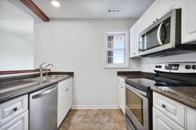 Building Photo - RENT SPECIAL! Freshly Painted! New Luxury Vinyl Plank Floors! Updated Lighting! Pool View Unit! C...