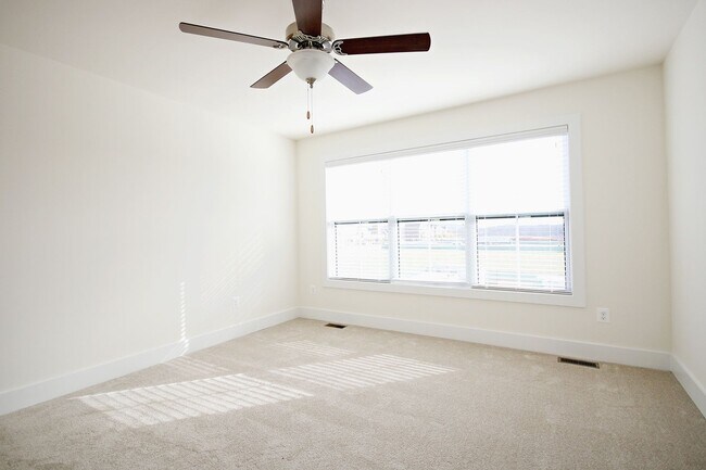 Building Photo - Pet-Friendly Old Trail Townhome With Rooftop Terrace