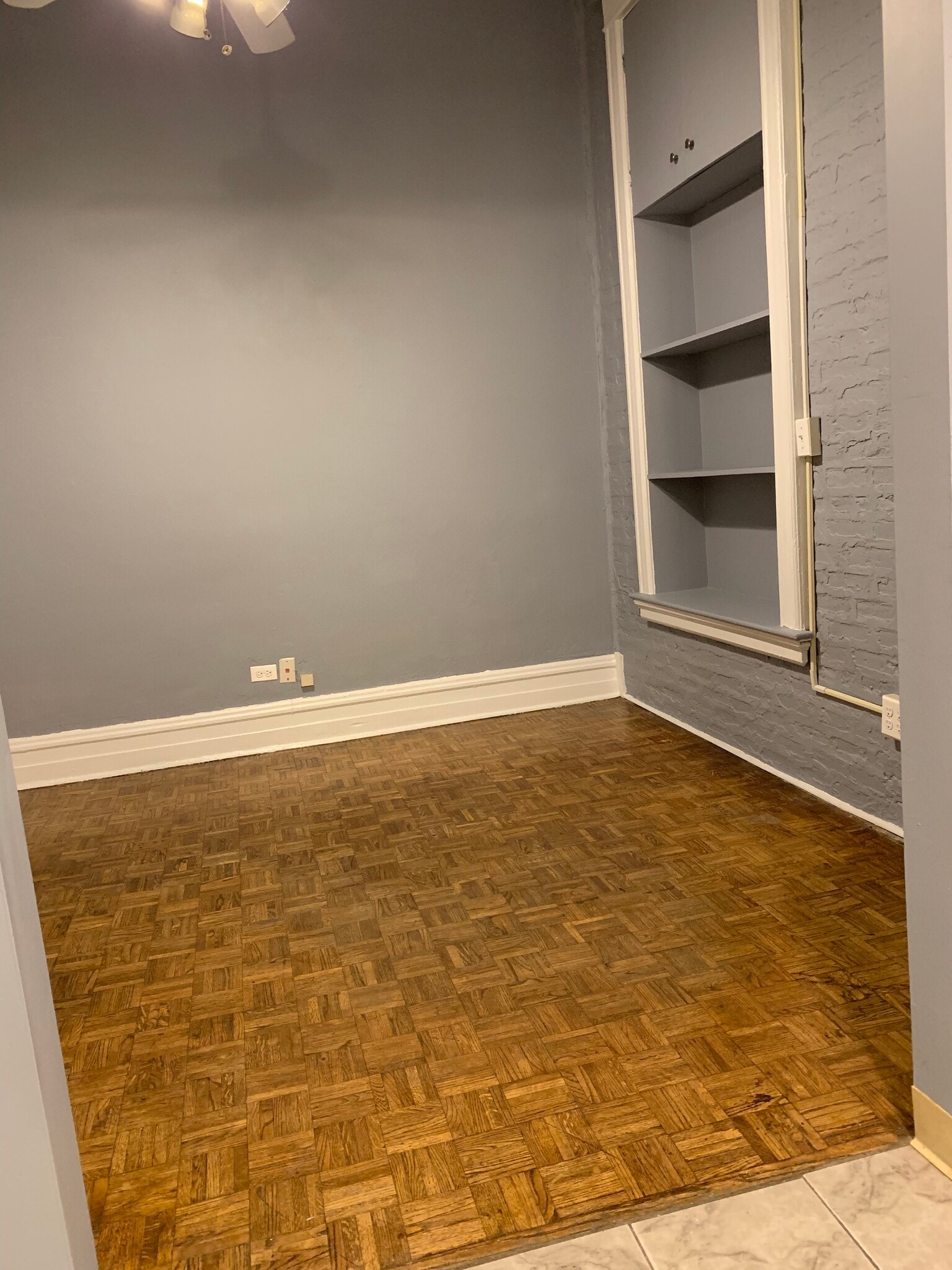 Main Room with storage - 2800 N Pine Grove Ave