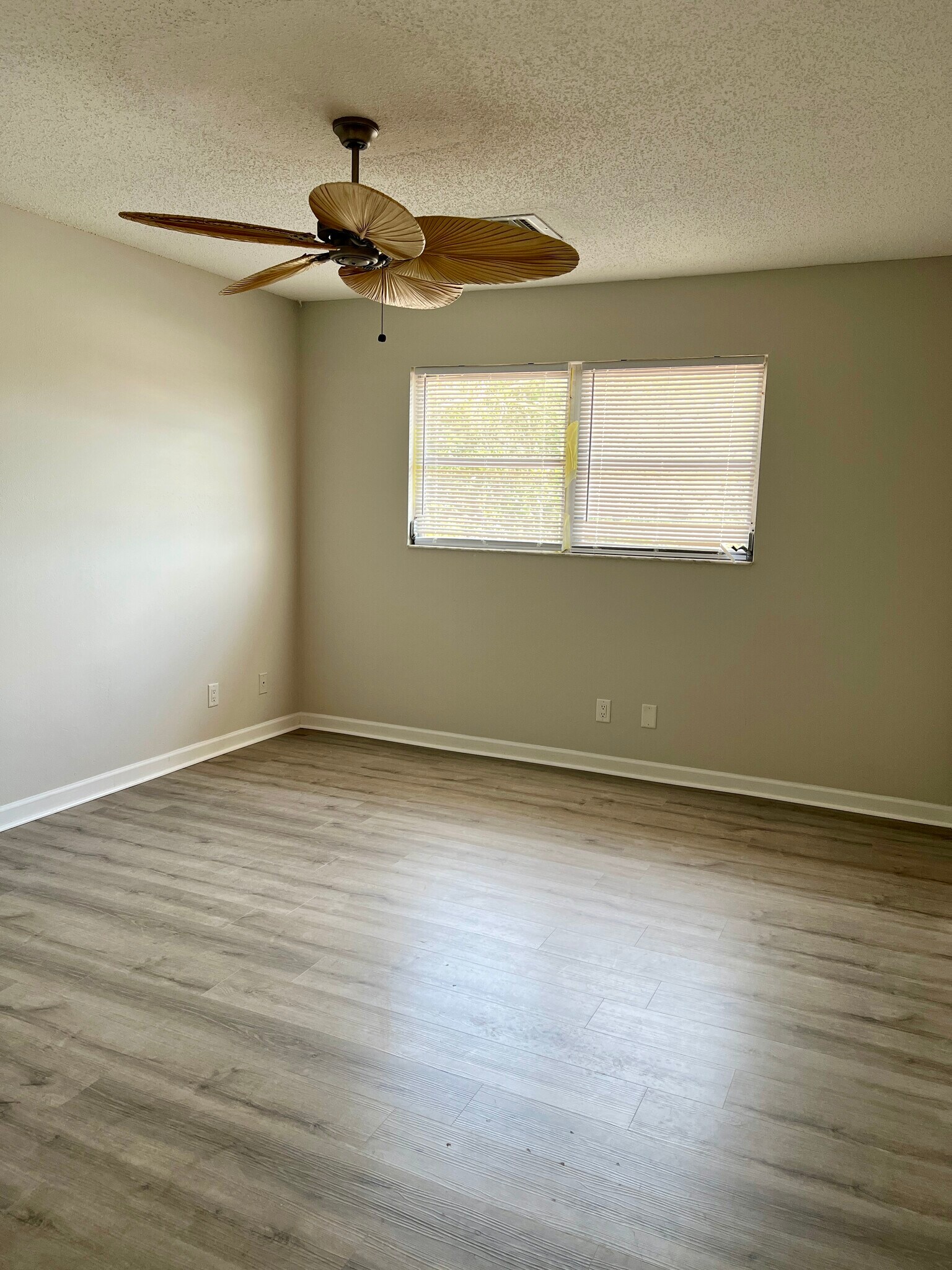 Spacious bedroom easily accommodates a king bedroom suite with nightstands and a dresser. - 7006 Midnight Pass Rd