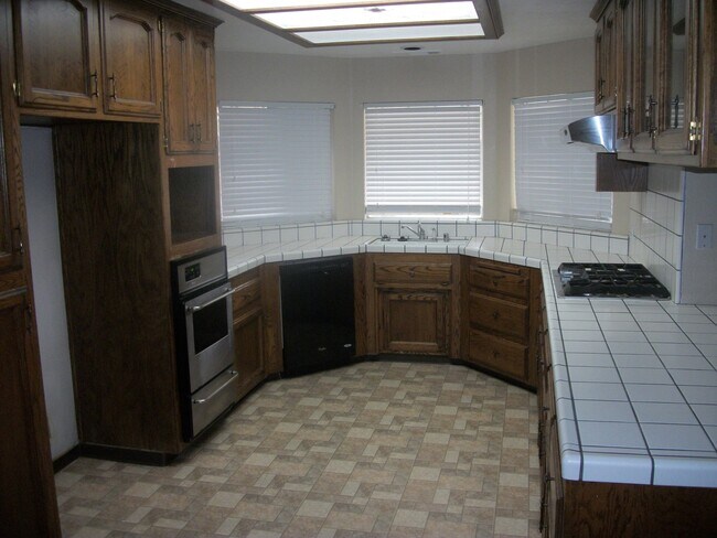 Building Photo - Coming Soon: Spacious Renovated 3 Bedroom Rosedale Home with Pool, Dual Fireplaces & Covered Patio
