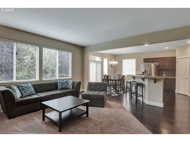 Building Photo - Bright and Open Floor Plan with Fireplace, Attached Garage & Vaulted Ceilings