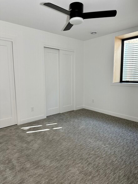 Two closets and ceiling fan in bedroom. - 4600 36th Ave S