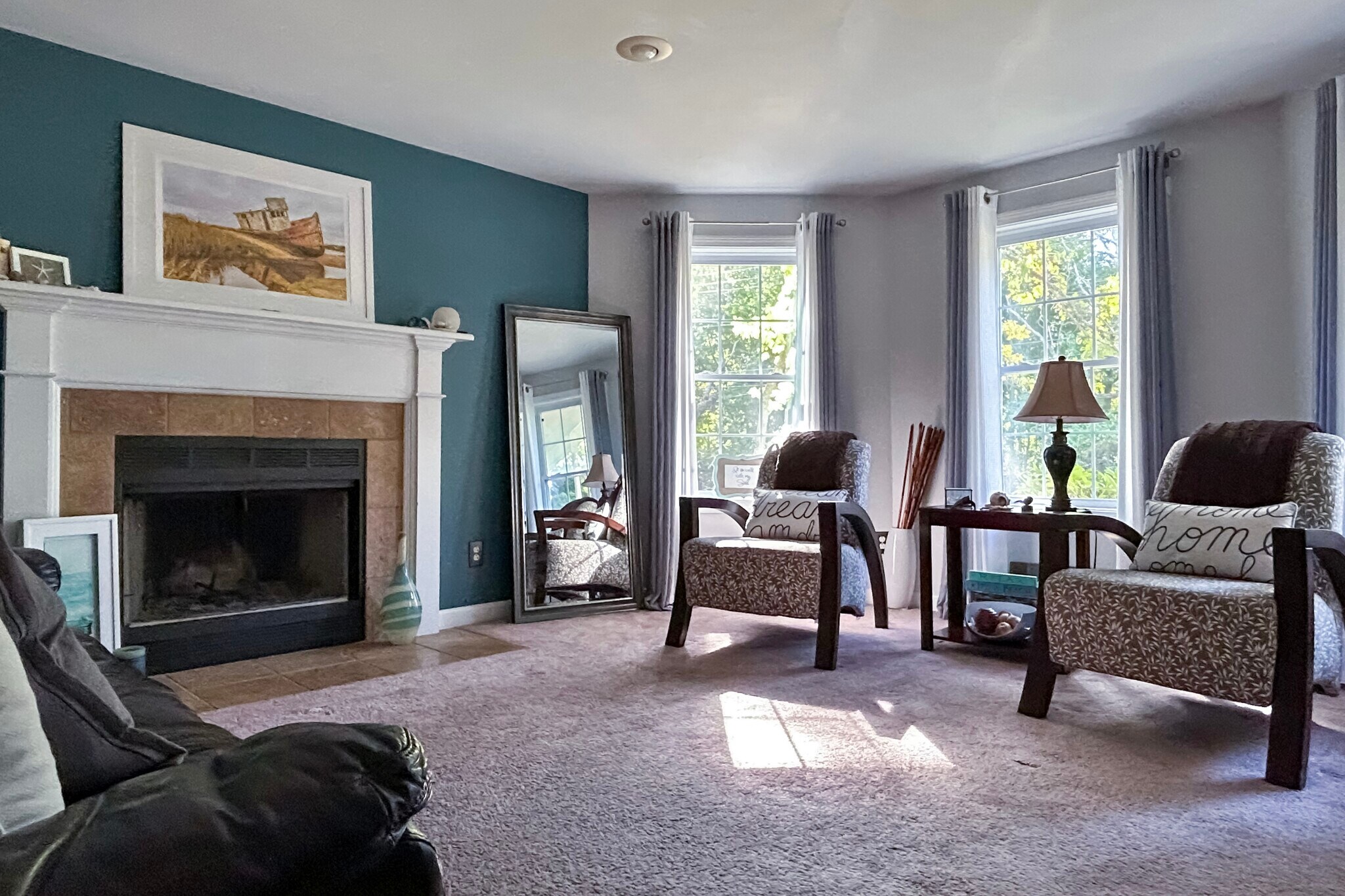 Downstairs den with working fireplace and bay window seating area - 278 Harrison St