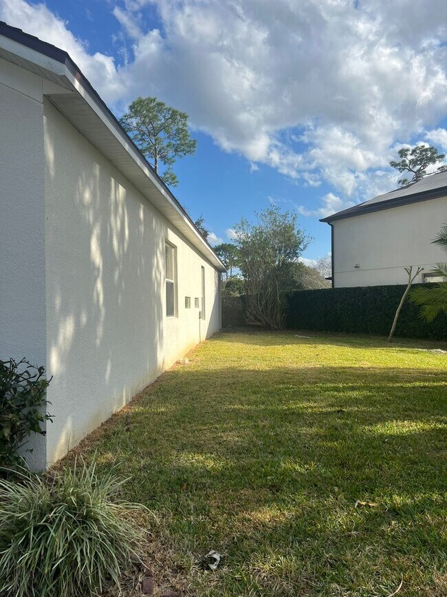 Building Photo - Water view 4/2 home in gated Spring Glen Community-Move-In Ready- 2 Car Garage- Debary!