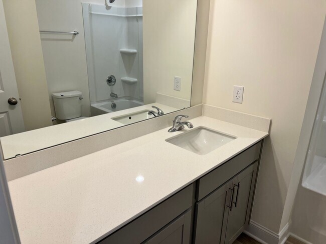 Building Photo - Like-New 3BR Townhome in Spring Village | Garage | Minutes to Downtown Angier