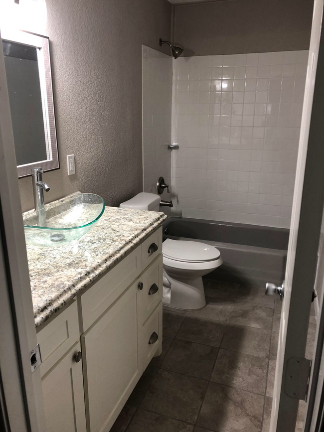 Bathroom with bathtub/shower - 1822 Avenue M 1/2