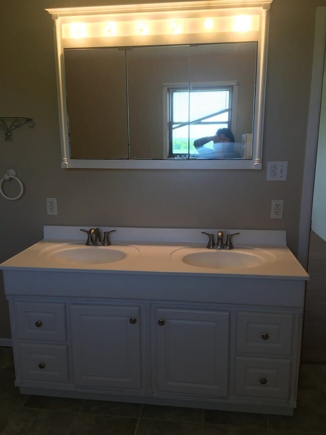 Building Photo - Beautiful secluded 4 bedroom 2.5 bath home with 2 stall detached garage and descent sized yard