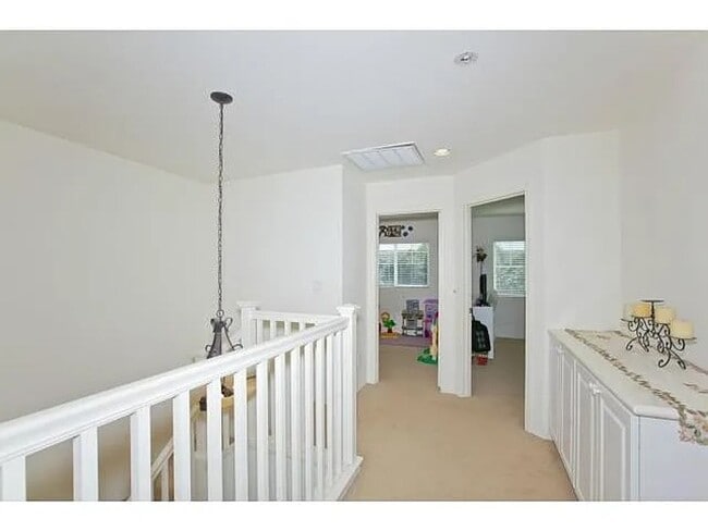 Building Photo - A stunning two-story house boasts three spacious bedrooms and 2.5 bathrooms