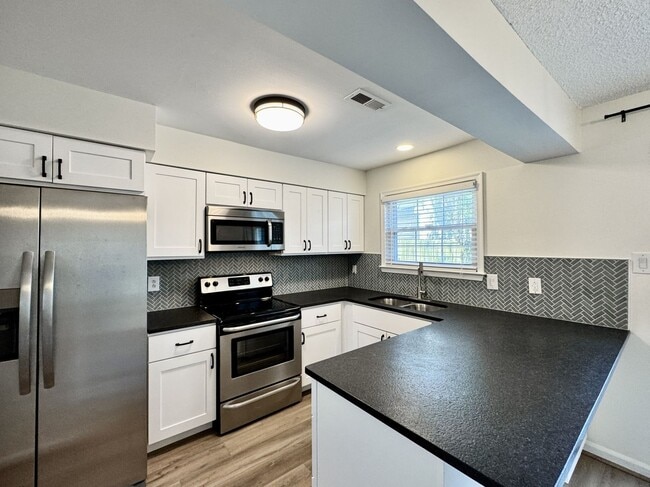 Building Photo - Completely Renovated & Ready 02-25-26! 2 Primary Suites, All Appliances Convey and Dog-Friendly!