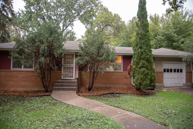 Front of the house with the attached garage and mudroom on the right. - 1911 Talmage Ave SE