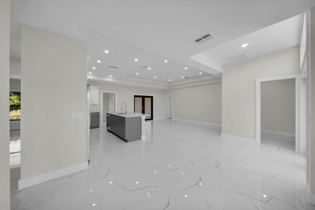 Building Photo - Brand-New Home in Lehigh Acres – Move-In Ready! FL 33974. Qualify for a deposit-free option and s...