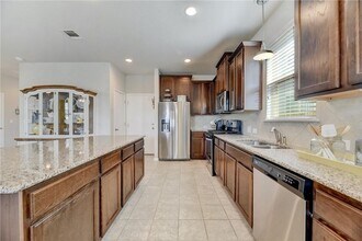 Building Photo - Modern Luxury Awaits in Buda – Stylish 4/B...