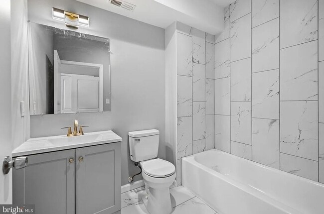 Building Photo - East District 3 BR/3.5 BA End Row Home w-Private Parking