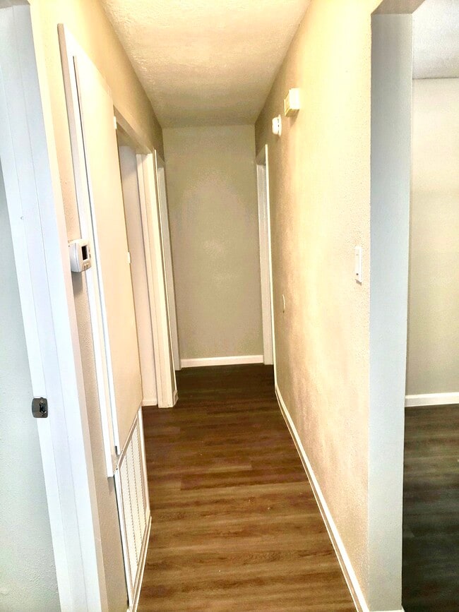 Hallway to bedrooms and laundry room - 10015 Valley Lake Dr