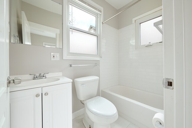 First floor bathroom directly off of the kitchen and mud room/laundry room - 2354 Victor St