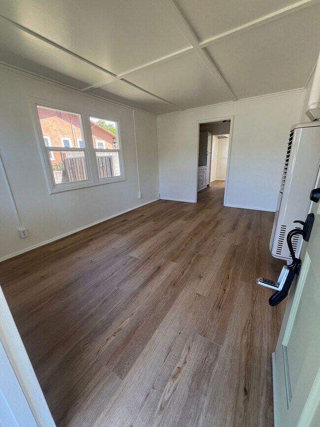 Building Photo - CHARMING! Remodeled 2 Bedroom home with storage and yard