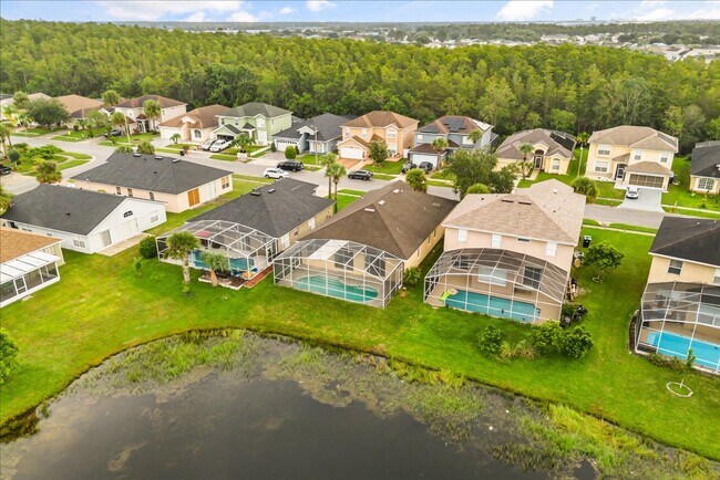 Building Photo - Stunning 4-Bedroom Lakefront Pool Home in Bridgeview at Meadow Woods
