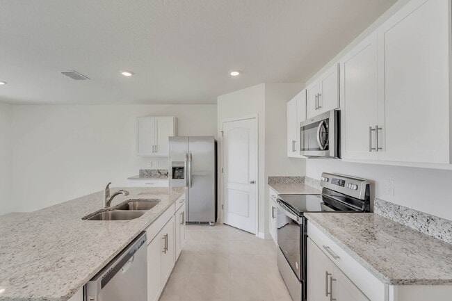 Building Photo - 4 bedrooms and 2 bathrooms, the spacious 1,828 sq ft home features an open concept with a 2 car g...