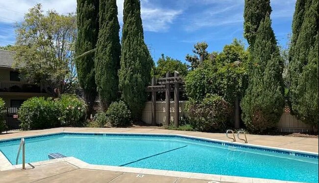Building Photo - Available Now is a Beautiful Condo Located...