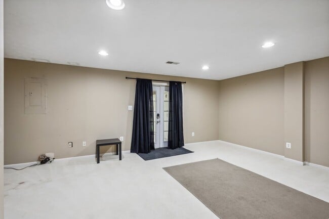 Building Photo - Modern Brick End-Unit Townhome with Stunning Upgrades and Serene Wooded Views