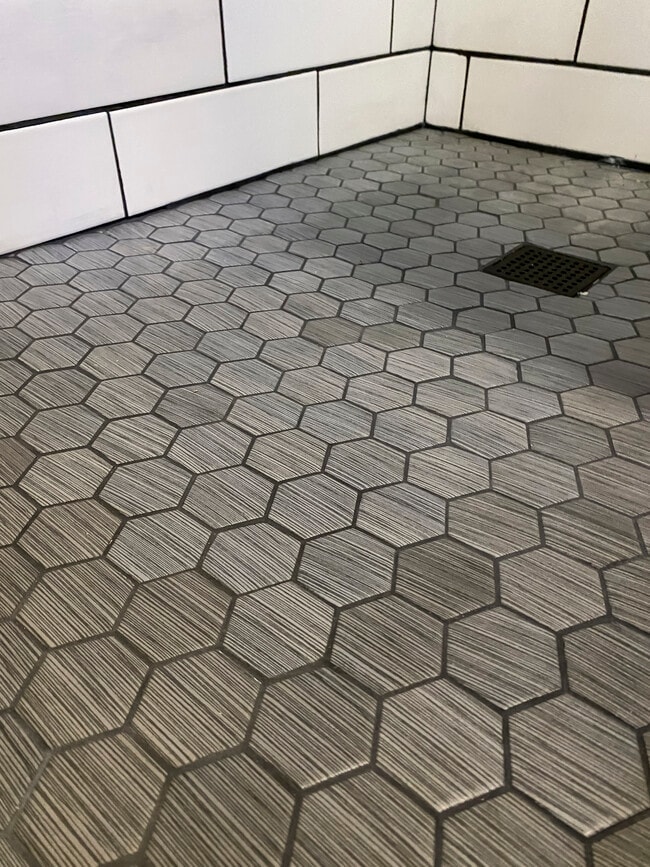 Custom tile shower floor in mid-level bathroom - 1606 S Lake Irving Dr SW