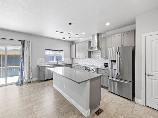 Building Photo - 4-Bedroom Townhome with Finished Basement, Garage & Private Outdoor Space