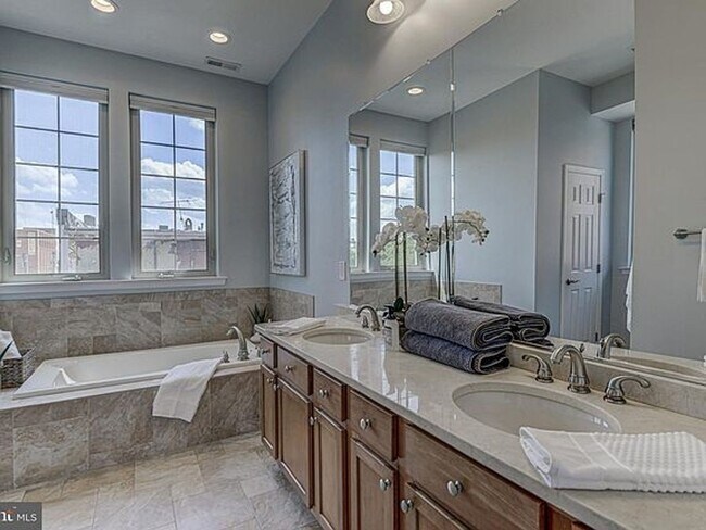 Building Photo - Beautiful EOG 3 bedroom  2.5 bath townhome with a 2 car garage and roof top deck overlooking the ...