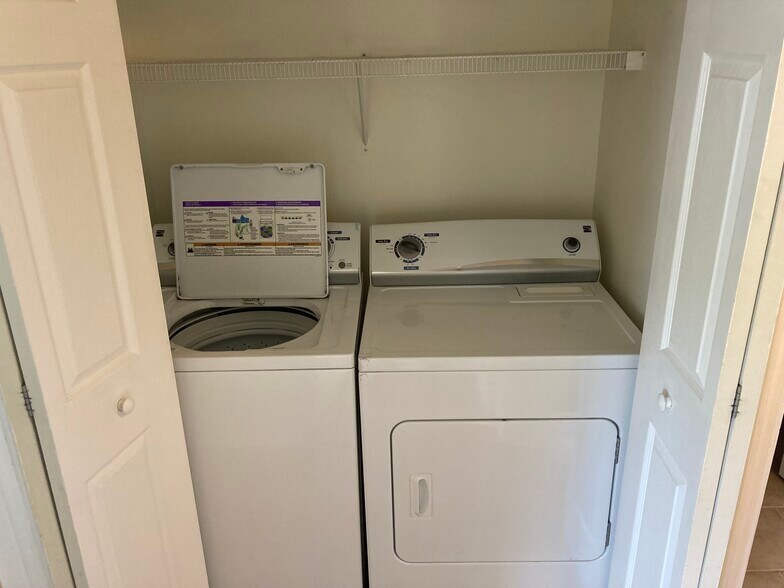 Washer and dryer centrally located by all bedrooms - 1419 Founders Way